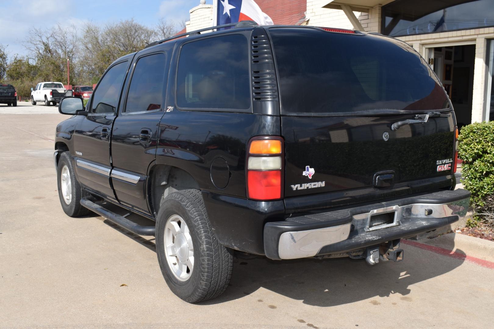 2004 Black /Tan GMC Yukon (1GKEK13Z64R) , located at 5925 E. BELKNAP ST., HALTOM CITY, TX, 76117, (817) 834-4222, 32.803799, -97.259003 - Buying a 2004 GMC Yukon 4WD can offer several benefits, including: Versatility: The GMC Yukon is known for its versatility, offering ample passenger seating and cargo space. The 4WD capability enhances its ability to handle various road conditions, making it suitable for both urban and off-road dri - Photo#2